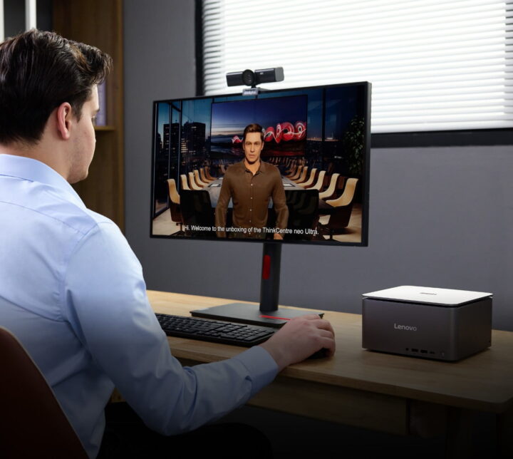 A person looking at a computer monitor