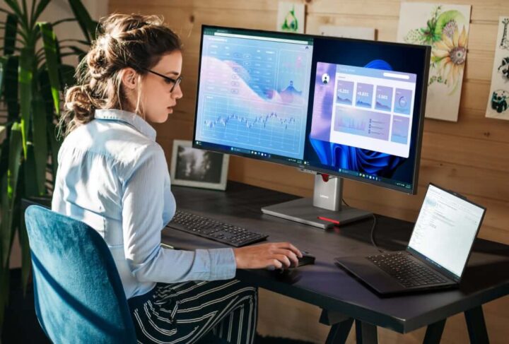 A person sitting at a desk using a computer