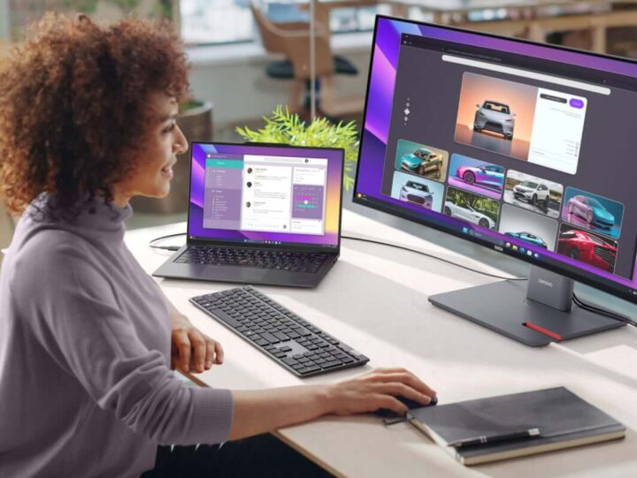 A person sitting at a desk using a computer