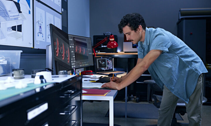A person standing at a desk