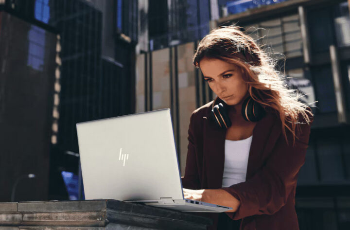 A woman using a laptop outside